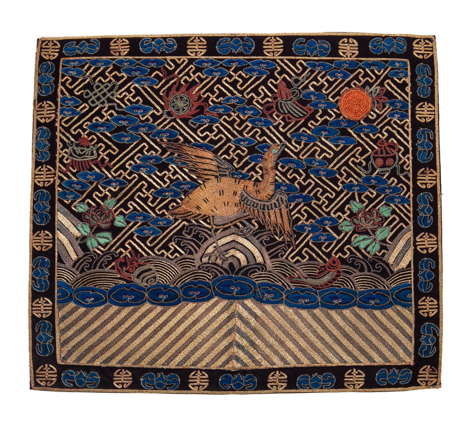 A CHINESE FRONT CIVIL RANK BADGE OF A CLOUD GOOSE: Chinese, Qing dynasty, 19th century, for a fourth rank civil official, embroidered in couched gilt thread depicting a wild goose amongst waves on a densely patterned ground and auspicious objects,the 