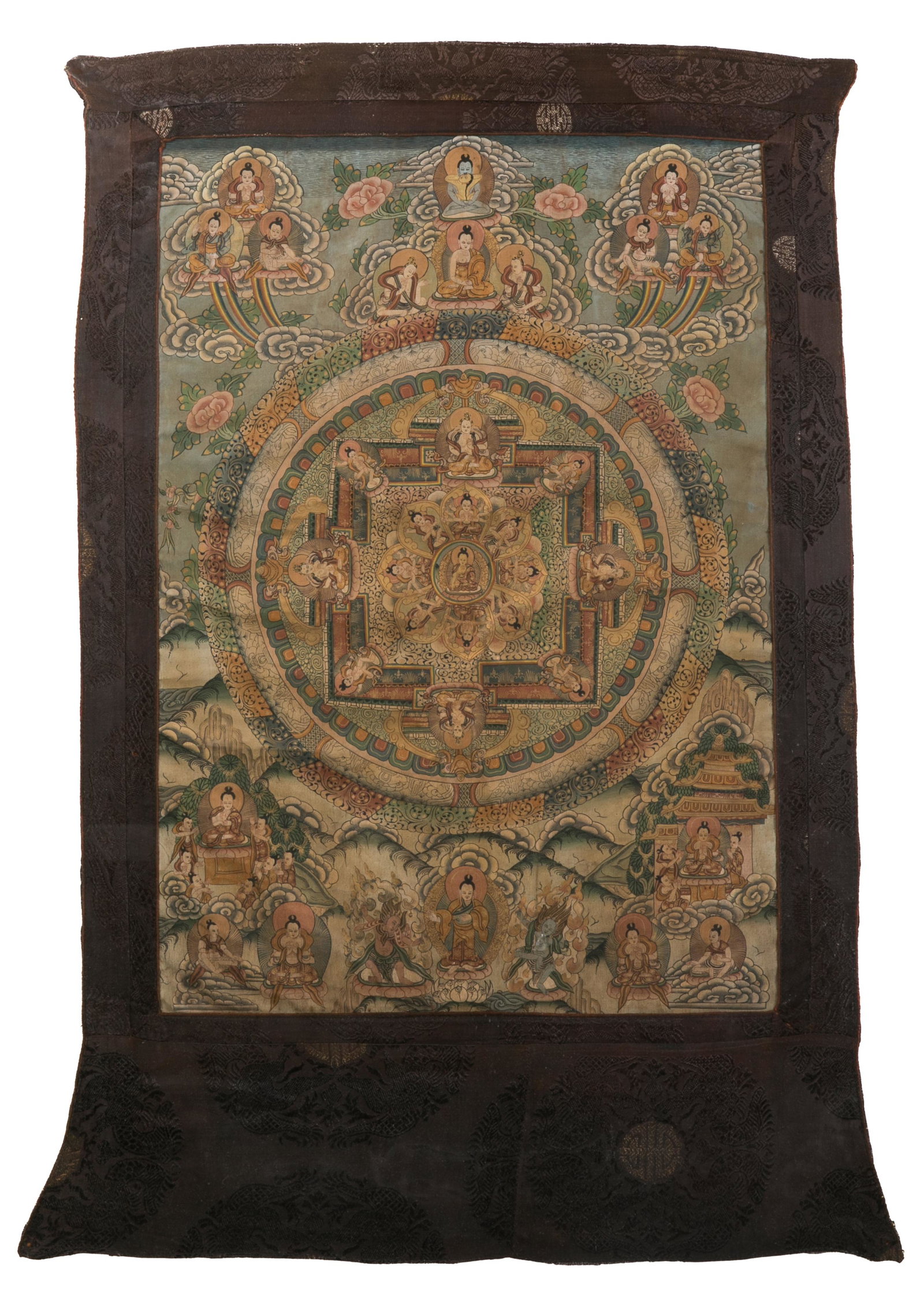 A TIBETAN THANGKA DEPICTING A MANDALA OF BUDDHA: Tibetan, a thangka depicting a mandala of Buddha accompanied by arhats. Image size: H. 59.5 x 40.5 cm (23 1/2 x 16 in.) Frame size: H. 101.4 x 69.9 cm (39 7/8 x 27 1/2 in.)