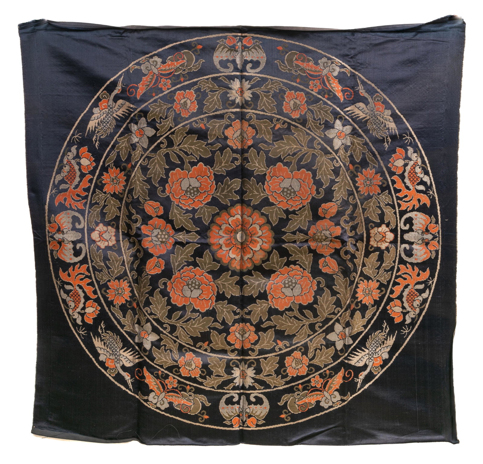 A CHINESE BLUE GROUND FLORAL EMBROIDERY PANEL: Chinese, finely embroidered with floral designs and auspicious animals in orange and gilt against a dark blue ground. Image size: 96 x 100 cm (37 3/4 x 39 3/8 in.)