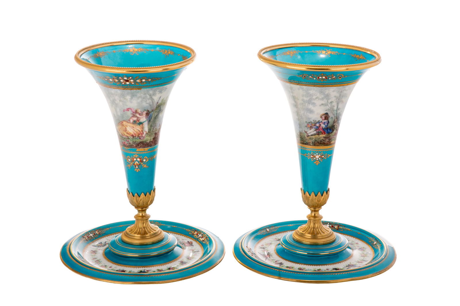FRENCH SEVRES STYLE PORCELAIN EPERGNES: A pair of fluted porcelain epergnes of typical bleu celeste ground, decorated with hand-painted fete galante, scrollwork enameling, and mounted with gilt bronze accents. Sevres style marks tobase, lat
