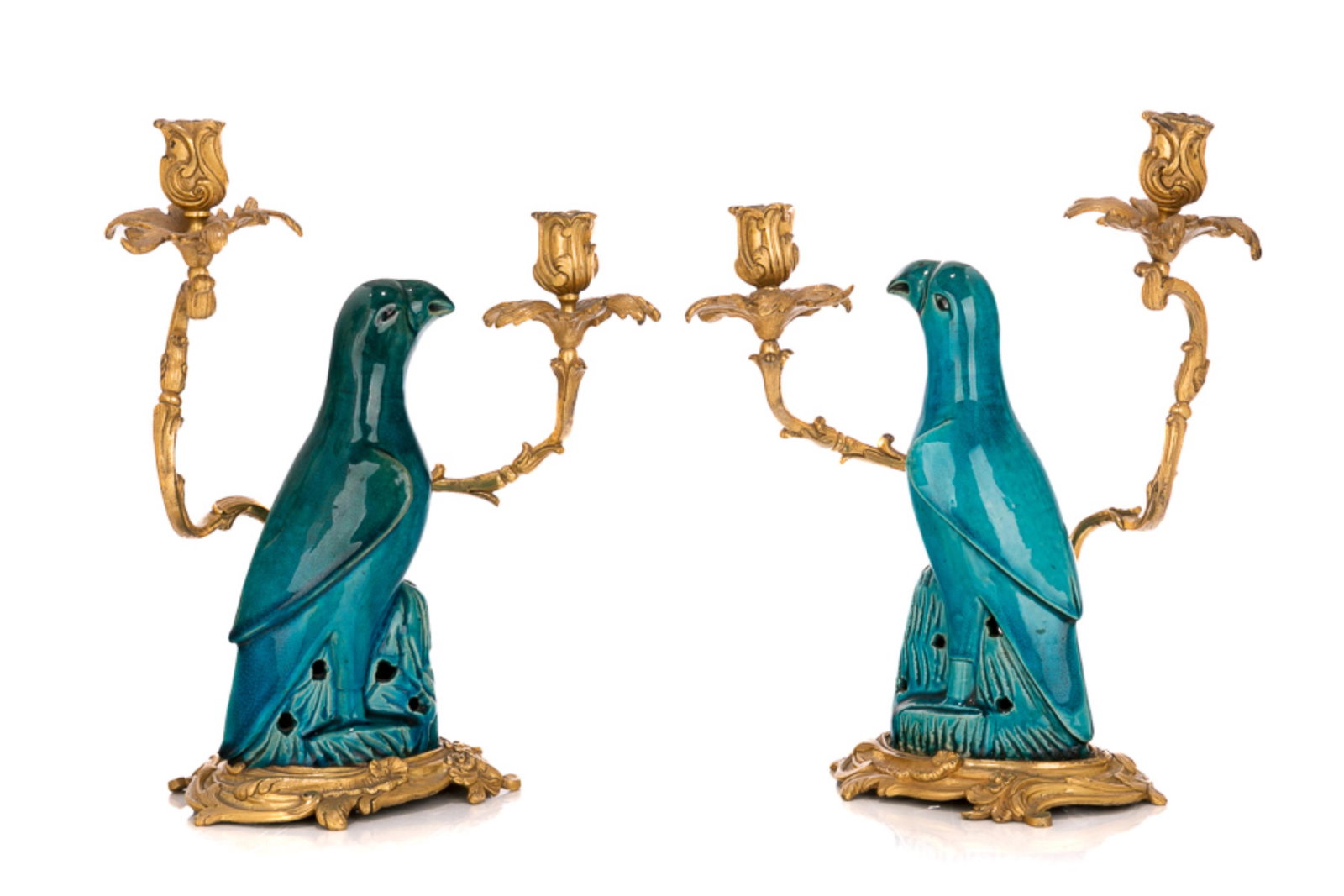 PAIR OF TURQUOISE GLAZE PORCELAIN BIRD CANDELABRA: Chinese, Qing dynasty, 18-19th century, pair of French gilt-bronze mounted turquoise glazed porcelain parrot candelabra. H. of the porcelain: 23.2 cm (9 1/8 in.), H. of the candelabra: 32 cm (12 5/8 i