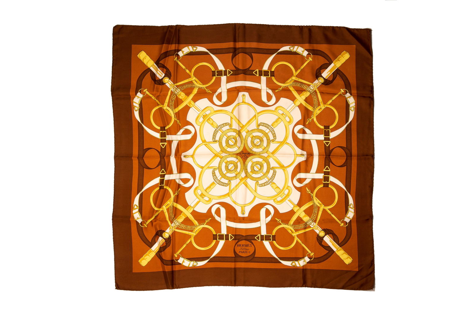 VINTAGE HERMES SQUARE SILK SCARF: Brown and multicolour in the "Eperon d'Or" pattern, designed by Henri d'Origny. L. 90 cm (35 1/2 in.) Condition report available upon request.