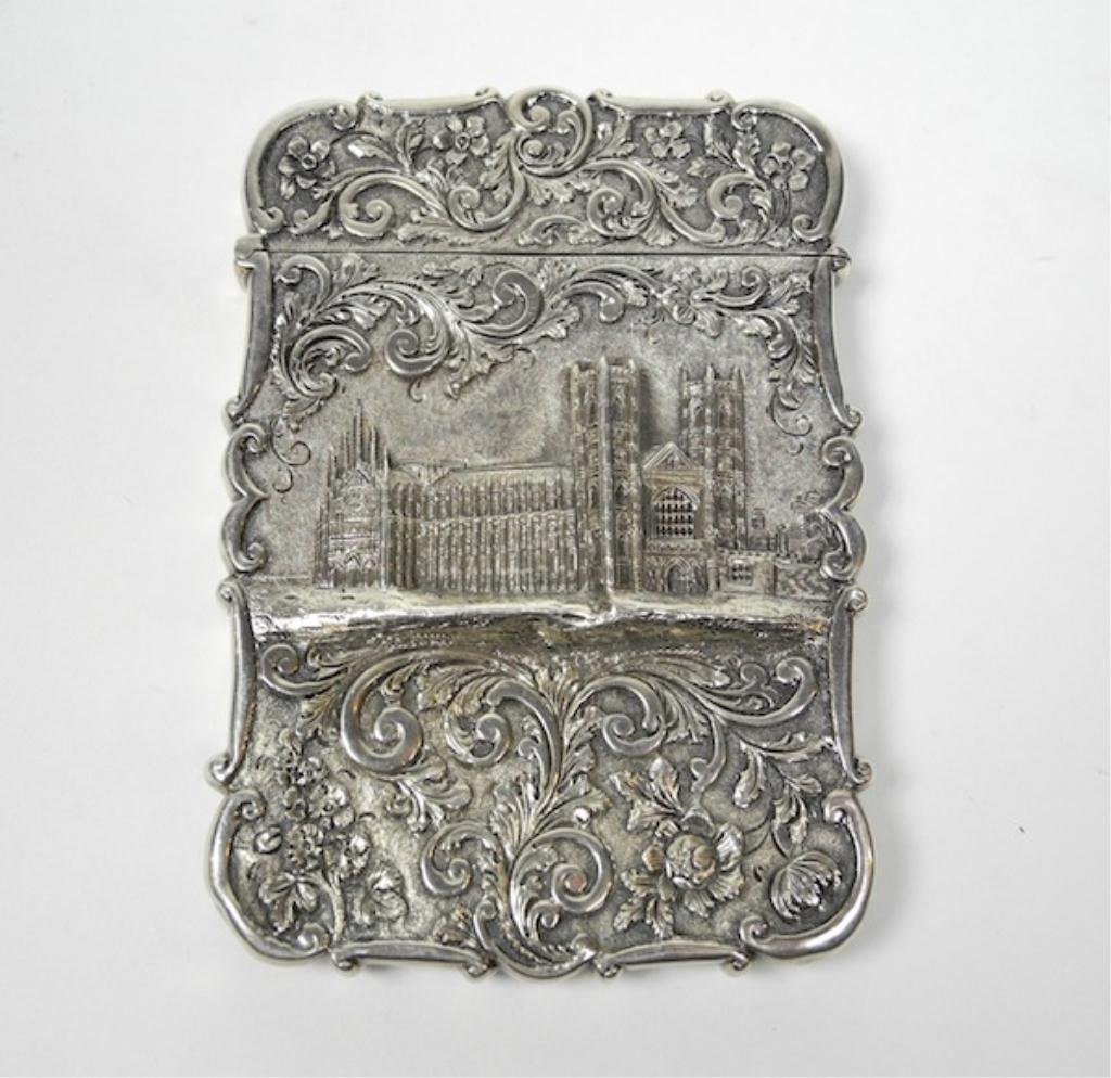 NATHANIEL MILLS SILVER CASTLE TOP CARD CASE: Birmingham, 1830, of typical form with a repousse Westminster Abbey castle-top front and cartouche on verso.