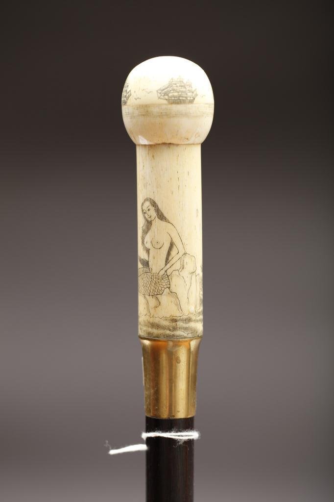 BONE KNOB WALKING STICK WITH COMPASS: Whale bone knob handle with scrimshaw engravings of mermaids and ships compass hidden in top of knob, L. 87cm (34.2 in.)