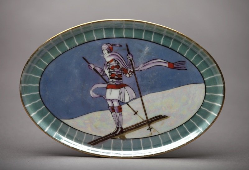 NORITAKE DRESSER TRAY: Of "Suzie Skier" on a lustre ground. Red M-in-Wreath. W 21 cm. (8 1/4 in.)