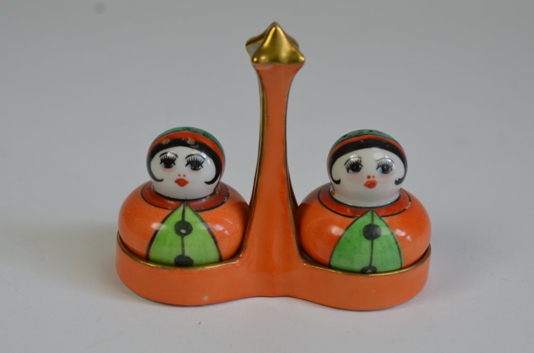 NORITAKE THREE PIECE CONDIMENT SET: Orange ground tray with figural lady salt and pepper shakers, Red Japan. W 10 cm. (3 7/8 in.)