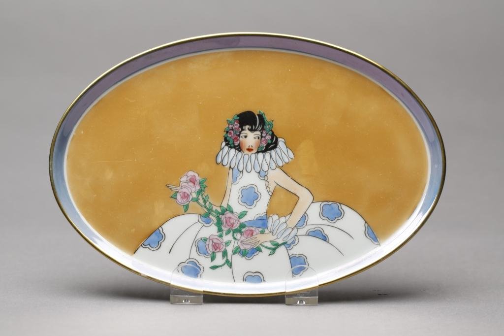 NORITAKE LUSTRE DRESSER TRAY: Caramel with blue border and girl in a blue and white dress with ruffled collar. Red M-in-Wreath, L 21.4 cm. (8 1/8 in.)