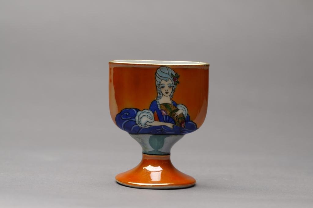 NORITAKE OPEN CIGARETTE BOX: Orange lustre ground with a lady in blue gown with fan. Red M-in-Wreath, L 10 cm. (4 in.)