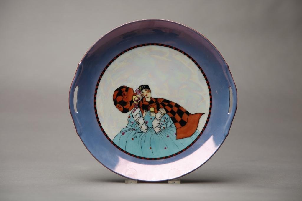NORITAKE LUSTRE SANDWICH PLATE: White pearlized ground with a lady in cape and purple lustre border. Red M-in-Wreath, Dia 24.5 cm. (9 3/4 in.)