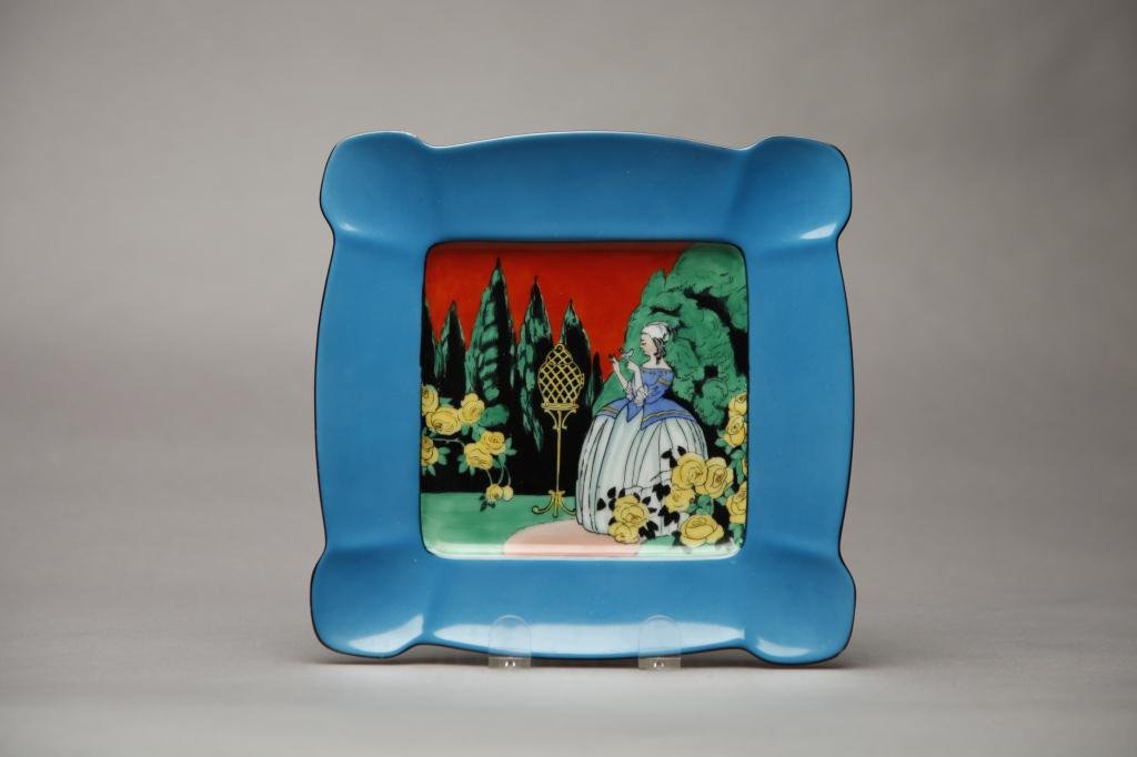 NORITAKE LANDSCAPE MOTIF CAKE PLATE: Scalloped square dish with girl and bird in garden with brilliant turquoise border. Red M-in-Wreath, W 22.5 cm. (8 7/8 in.)