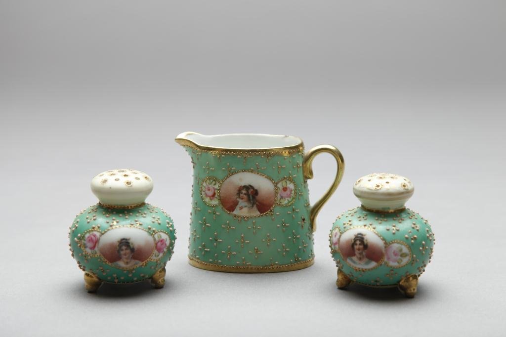 NIPPON THREE PIECE CONDIMENT SET: Green ground with a portrait of a lady and beaded decoration (minor chip to creamer). Blue Maple Leaf, H 7.6 cm. (3 in.) Minor chip to rim of cream jug, a few beads missing