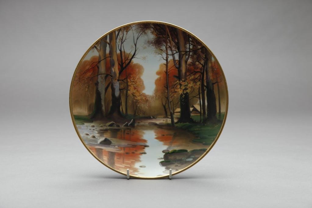NIPPON HAND PAINTED PLAQUE: Fall landscape motif with birch trees. Green M-in-Wreath, Dia 25.7 cm. (10 1/8 in.)