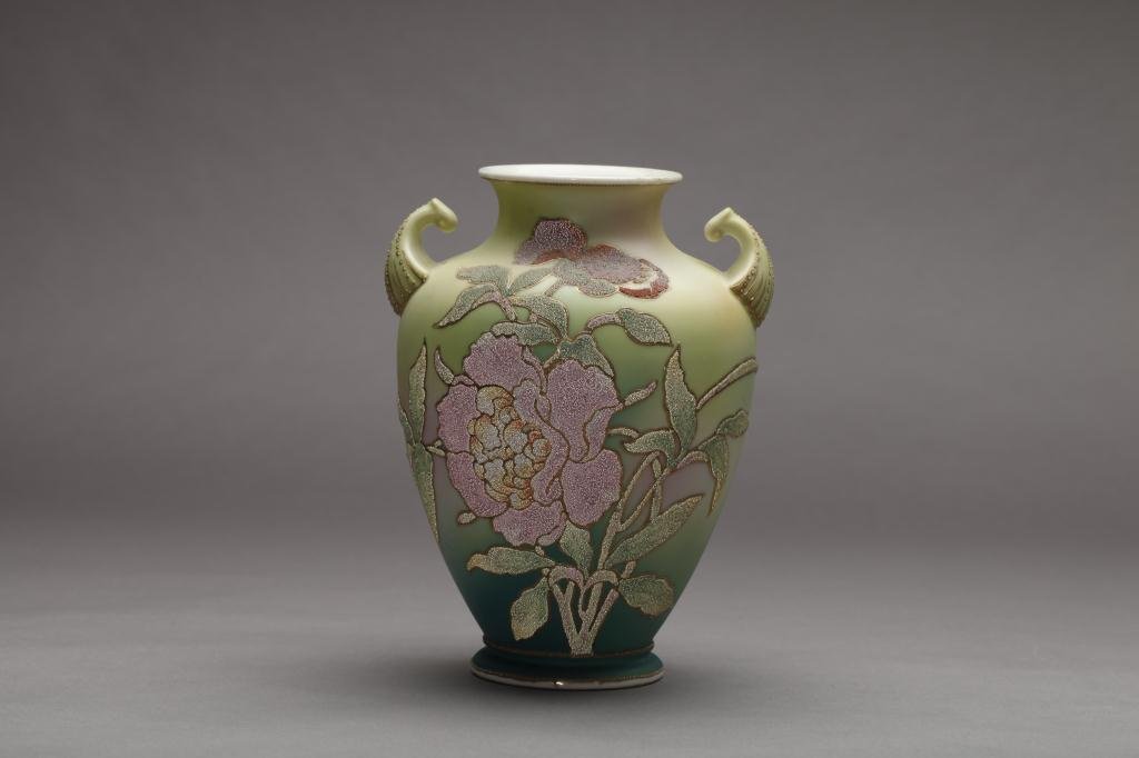 NIPPON CORALENE DECORATED TWO-HANDLED VASE: Beaded glass pink peonies on a pale green to blue satin ground (hairline). Kin Ran Patent mark, H 23.2 cm. (9 1/8 in.) Hairline to inside rim of vase