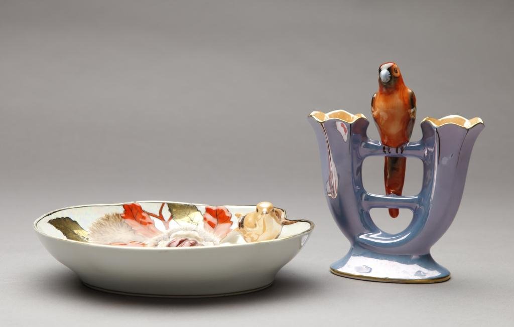 TWO PIECES FIGURAL LUSTRE ART DECO NORITAKE: Double vase with perched parrot and dish with moulded nest and bird. Green M-In-Wreath, L of dish 22.7 cm. (9 in.) Minor wear to paint on parrot