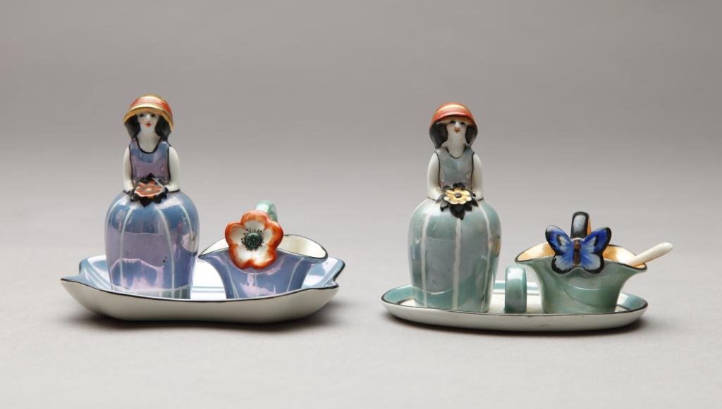 TWO SETS OF FIGURAL NORITAKE CONDIMENTS: Each including a figural shaker, an open basket salt and a tray. Red M-In-Wreath, L of tray 11.2 cm. (4 3/8 in.)