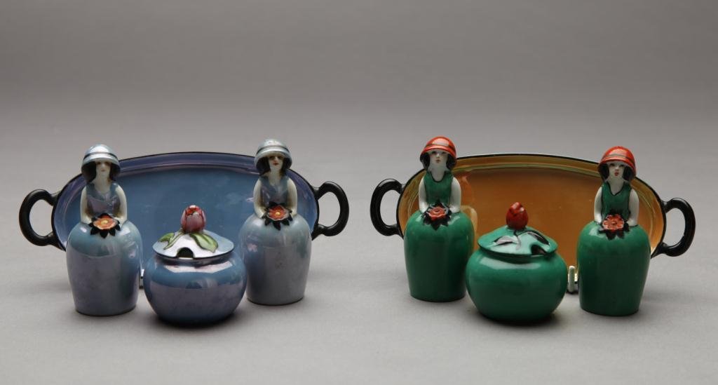TWO NORITAKE FIGURAL CONDIMENT SETS: Each set including a pair of figural shakers, covered pot and tray. Green M-In-Wreath, L 17.5 cm. (6 7/8 in.)