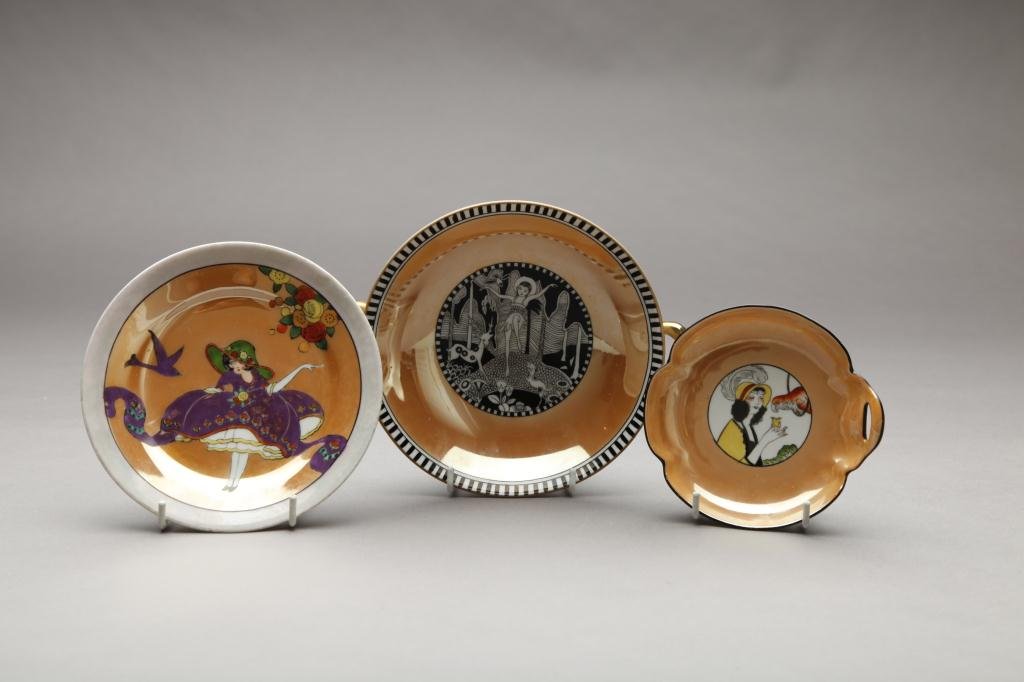 THREE PIECES OF CARAMEL LUSTRE FIGURAL NORITAKE: Forest Nymph handled comport and two small dishes. Green M-in-Wreath, W of comport 22 cm. (8 3/4 in.)
