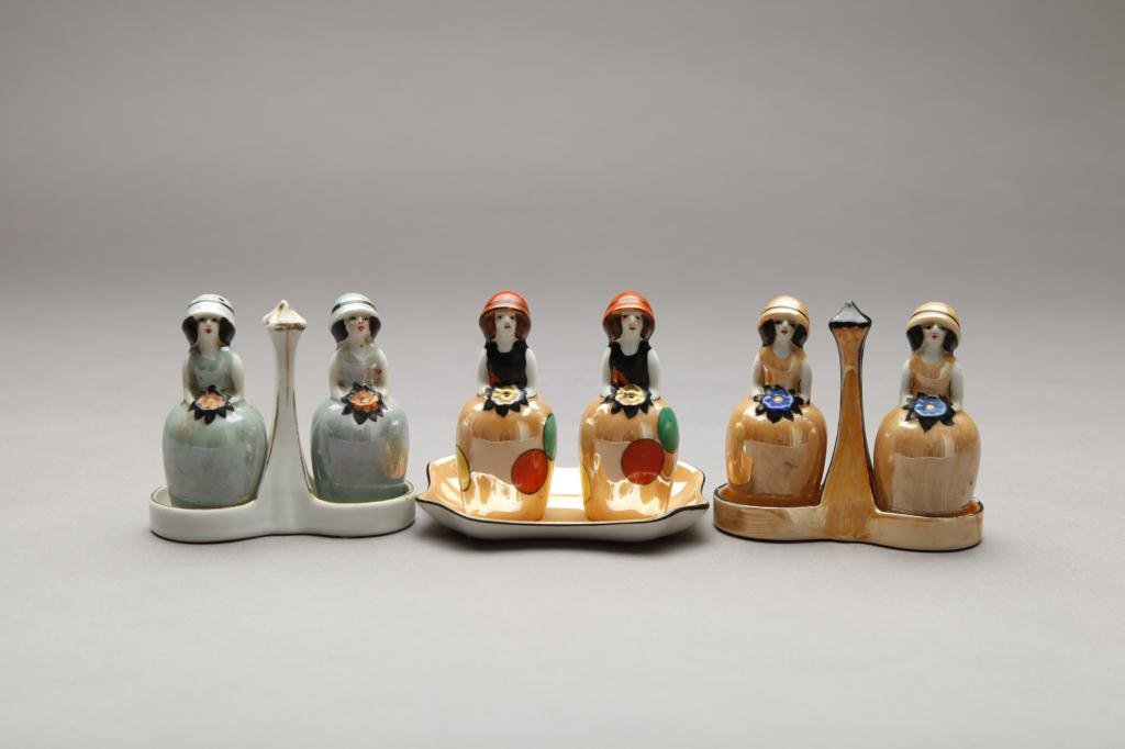THREE PAIRS OF NORITAKE FIGURAL SHAKERS: Each are brides maids with flowers (chip). Red & Green M-in-Wreath. H 8.8 cm. (3 1/2 in.) Green set with wear to dresses, on polka dot with small chip to hat