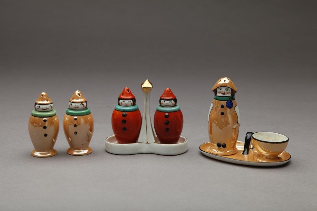 THREE PAIRS OF NORITAKE FIGURAL SHAKERS: Clowns in caramel lustre and red.