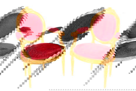PAIR OF PERIOD 18th C GILTWOOD ARMCHAIRS: Pair of French Louis XVI armchairs. In the manner of Louis Delanois (1731-1792). Oak frames, carved and gilded. Upholstered in maroon, patterned velvet. circa 1780. Supporting documentation suggesting