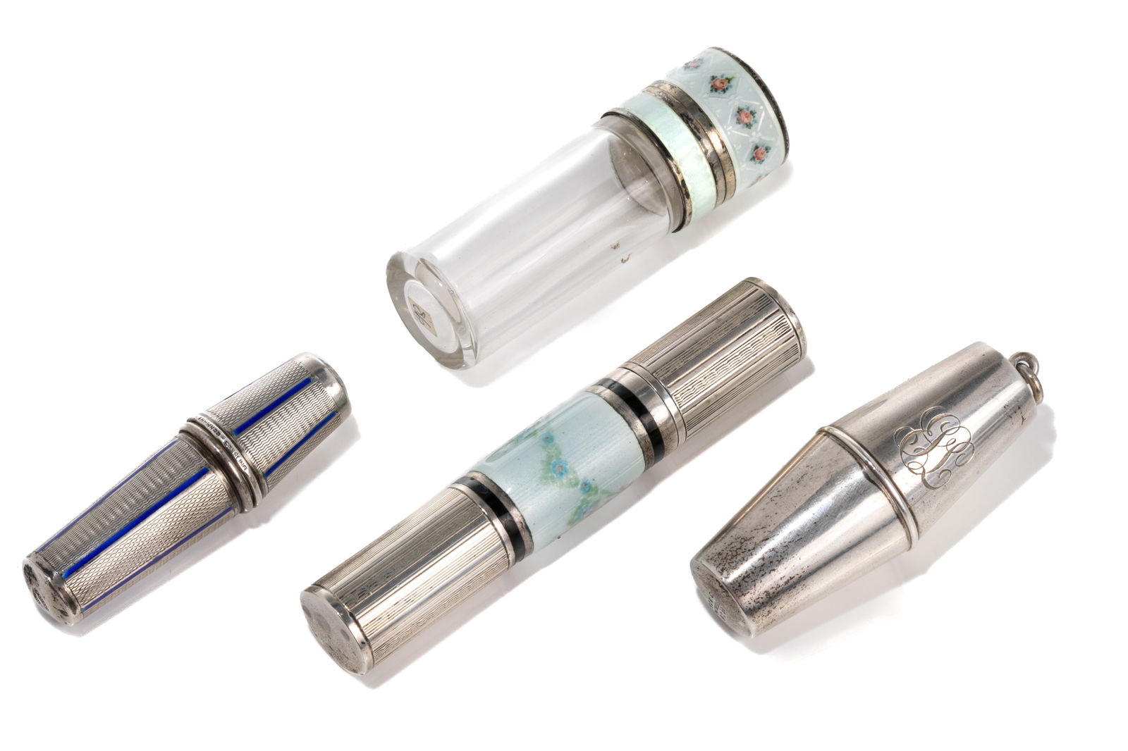 FOUR SILVER NECESSAIRE ITEMS: Two Art Deco sewing cases made in Germany with blue enamel and Gorham US, F&B sterling needle case and a scent bottle with blue guilloche enamel. L of needle case 7cm (2 3/4in)