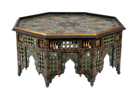 HEXAGONAL PAINTED MOROCCAN COFFEE TABLE: Decorative painted table in greens, pinks and with gilt accents, highly ornate with roundel top, first half 20th C, probably Moroccan or Indian. H. 23". W. 49".