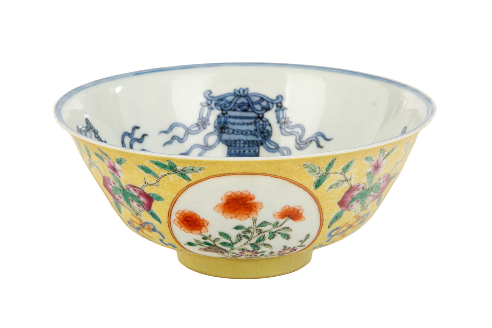 FAMILLE ROSE PORCELAIN BOWL: Chinese, 18 century, a white jade carved belt buckle with crouching chilong amid lingChinese, Hongxien mark, scraffito yellow exterior, enamel painted with bats, peaches and floral roundels, the inter