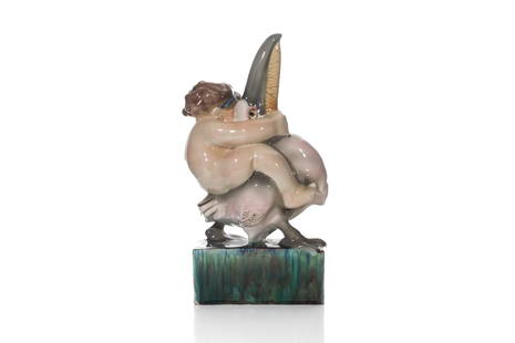 GOLDSCHEIDER PORCELAIN FIGURE WITH PELICAN: A 20th century Viennese figure of a putti riding a pelican after a model by Wiener Werkstatte artist Michael Powolny. The polychrome figure sits atop a integral base. Marked to base with inscribed ini