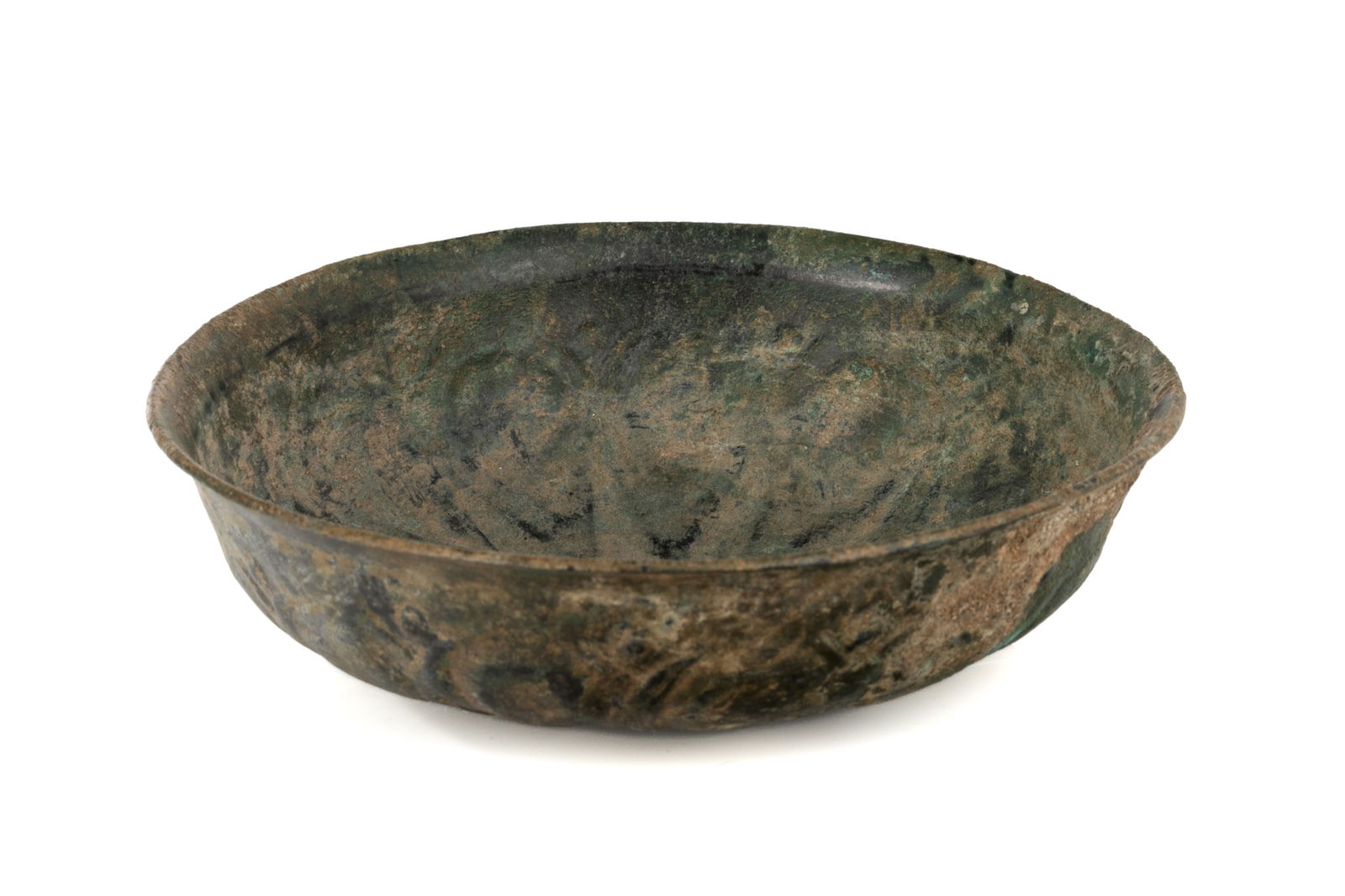 ACHAEMENID PERSIAN FLUTED PHIALE (WINE CUP): A shallow Persian bronze bowl or wine cup with lobed or fluted design to the body and a slightly flared rim. Persia, 500 B.C. Dia. 16cm (6 1/4 in.)