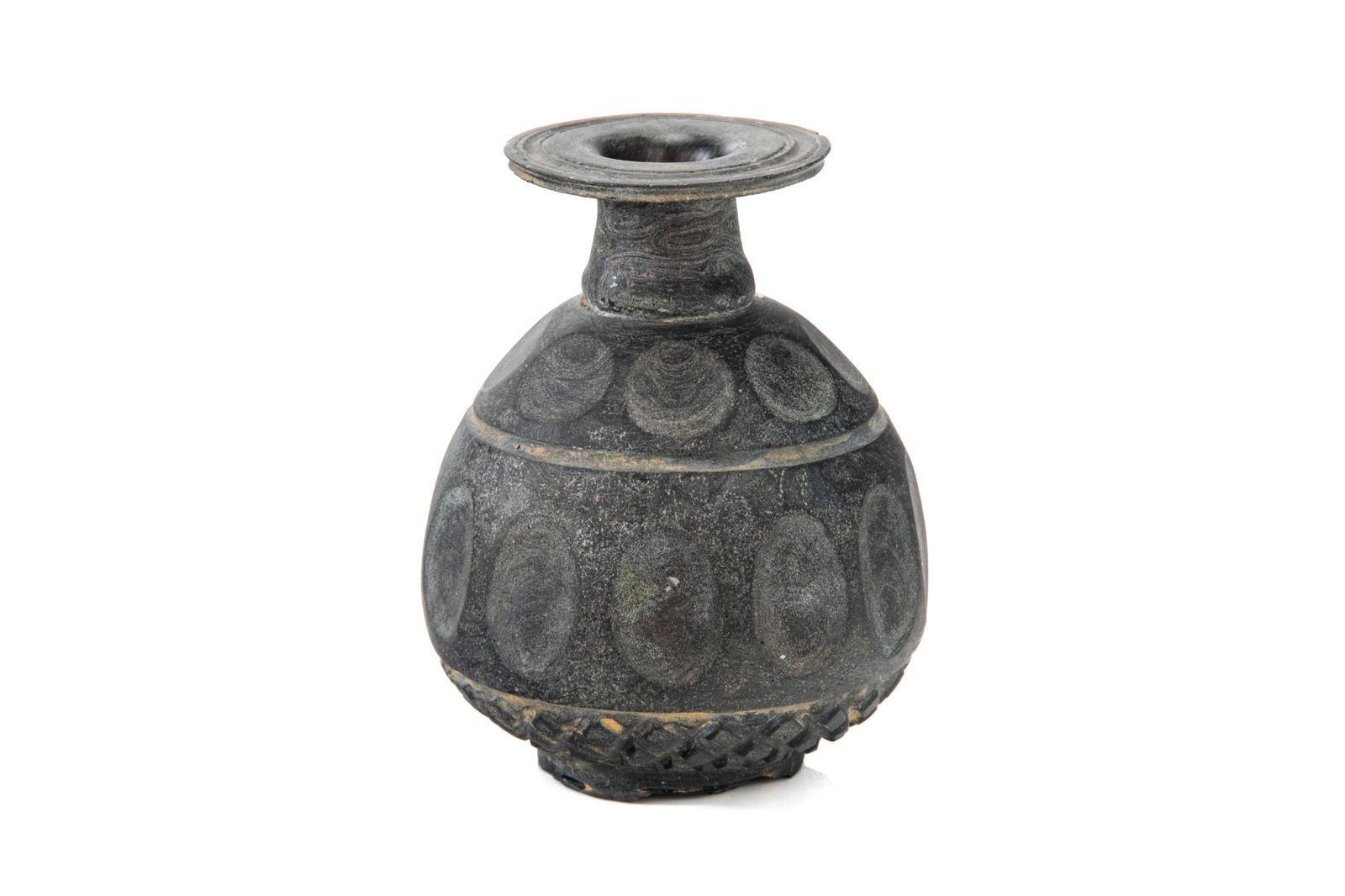 SASANIAN GLASS VESSEL: A black glass vessel with repeating designs to the body. Ancient Mesopotamia (Persia), circa 700 A.D. H. 11.5 cm (4 1/2 in.)