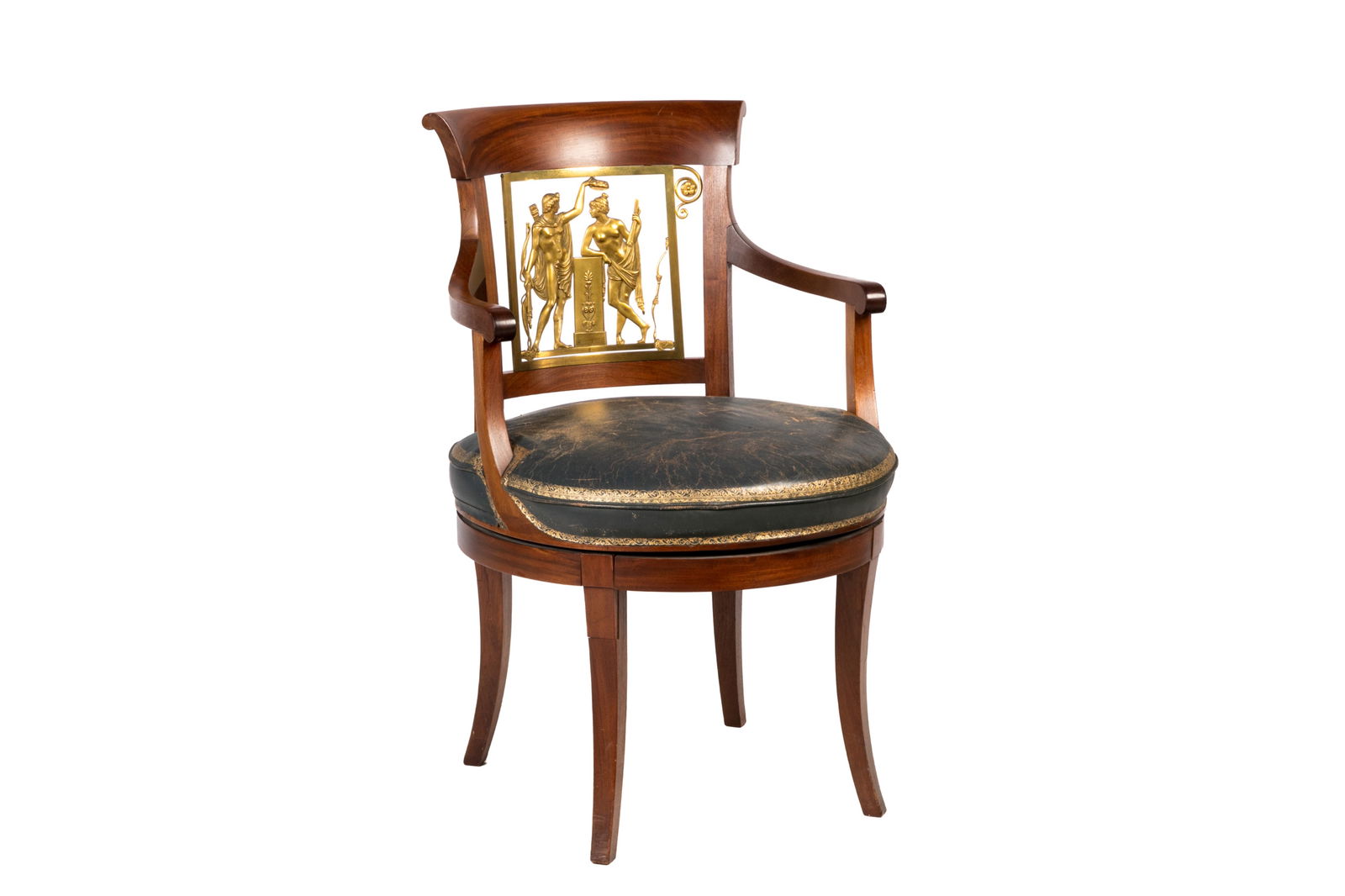 FRENCH OMOLU MOUNTED MAHOGANY SWIVEL CHAIR: Napoleon III Mahogany armchair with rounded seat upholstered in toled leather, the back of a Neo Classical gilt bronze splat In the manner of Jacob Freres, Paris. H.: 36'' W.: 23'' D.: 26''