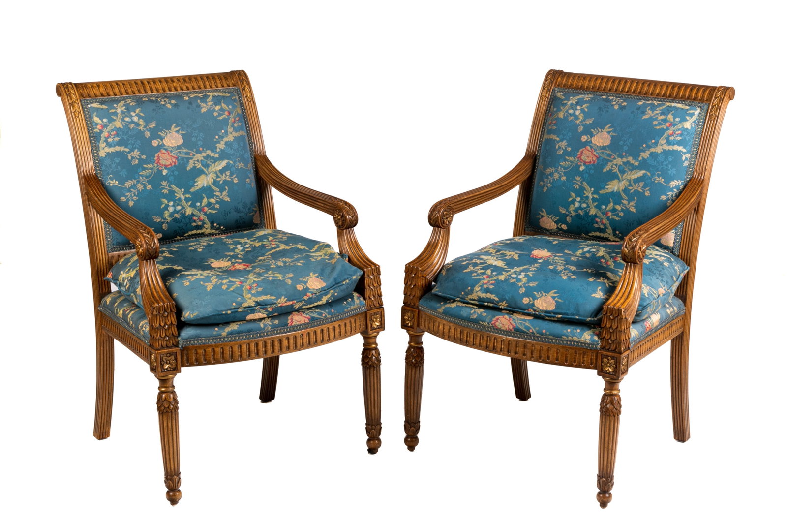 PAIR OF CARVED WOOD FRAMED ARMCHAIRS: French manner with blue brocade upholstered and down filled cushion seat. 20th / 21st C. H.: 36'' W.: 23'' D.: 26''