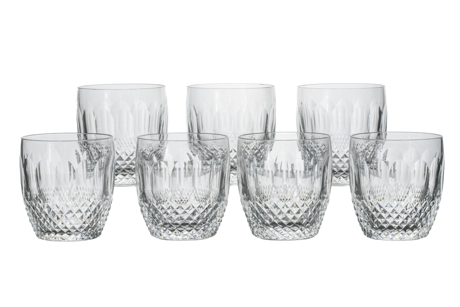 THIRTEEN WATERFORD COLLEEN OLD FASHIONED TUMBLERS: Set of 13 Waterford old fashioned tumblers in the pattern Colleen, with cut panels and cross hatching. Marked Waterford on base. Late 20th C.H.: 8.9 cm (3 1/2 in.)
