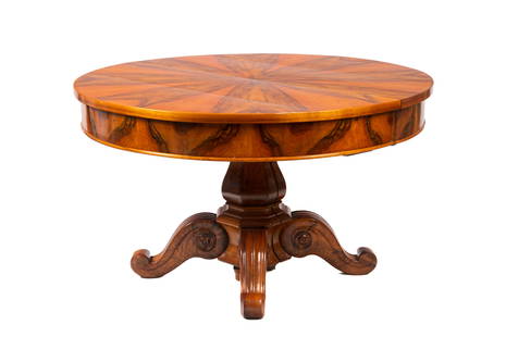 BIEDERMEIER BURLED WOOD BREAKFAST TABLE: Beidermeier round breakfast table with split pedestal base and four carved legs. Top appears to be rosewood veneer. The base possibly walnut. Deep skirt under top with figured veneer. Thetable opens t