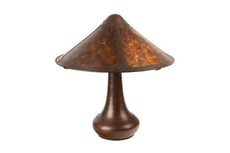 ADAMS FOR AURORA STUDIOS ARTS & CRAFTS TABLE LAMP: Hammered copper body with studded detail, mushroom shaped Mica shade. Made by Michael Adams for Aurora Studios. Signed Prototype #1 12/95 dated 1995. H: 58 cm (23 in.)