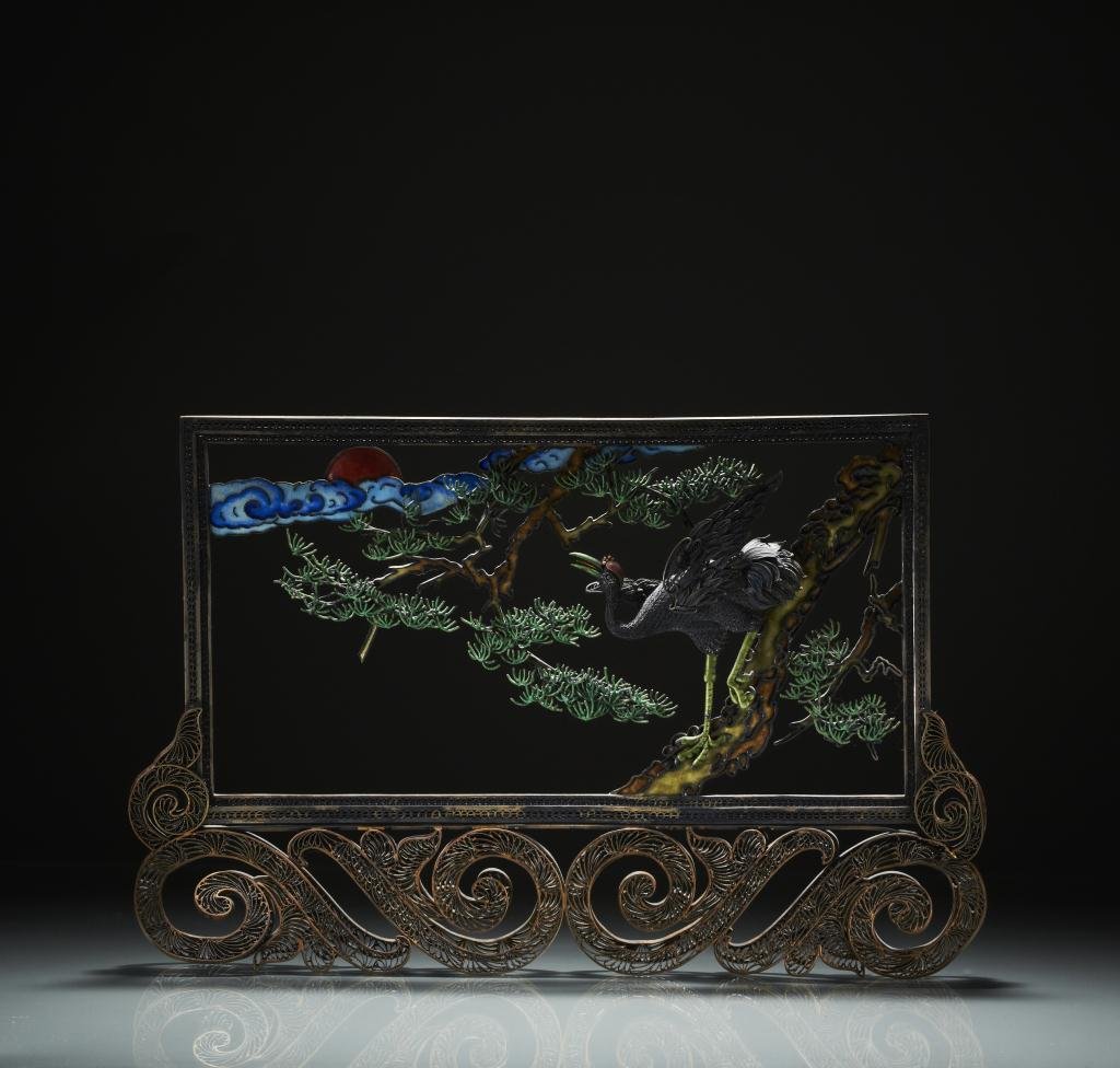 CHINESE SILVER AND ENAMEL TABLE SCREEN: Filigree frame with a perched crane with pine tree and sunset. L 27 cm. (10 5/8 in.) Provenance: from the collection of Mr. Abraham Abraham of The Jade Shop, Toronto.