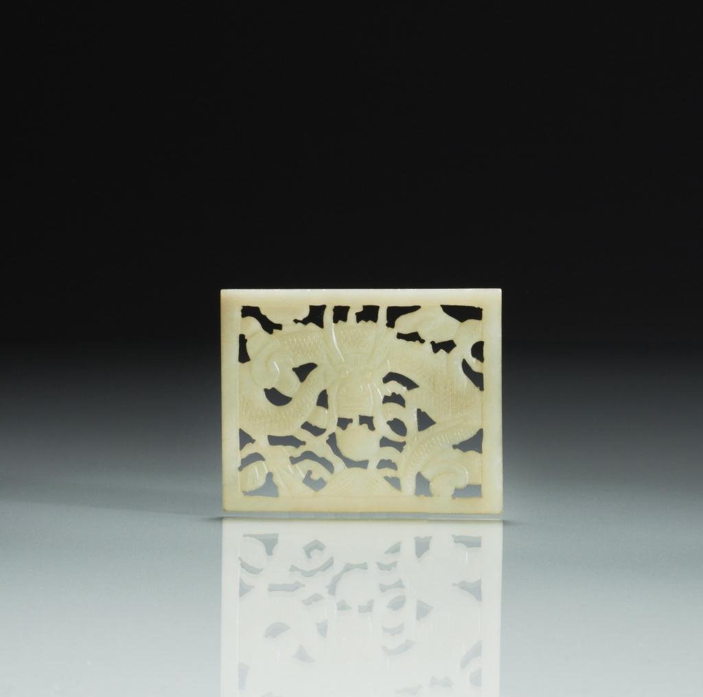 CHINESE CARVED JADE DRAGON PLAQUE: Yellow jade, rectangular shaped, carved with dragon on one side. W. 6.7cm (2 3/4 in.) Provenance: from the collection of Mr. Abraham Abraham of The Jade Shop, Toronto.
