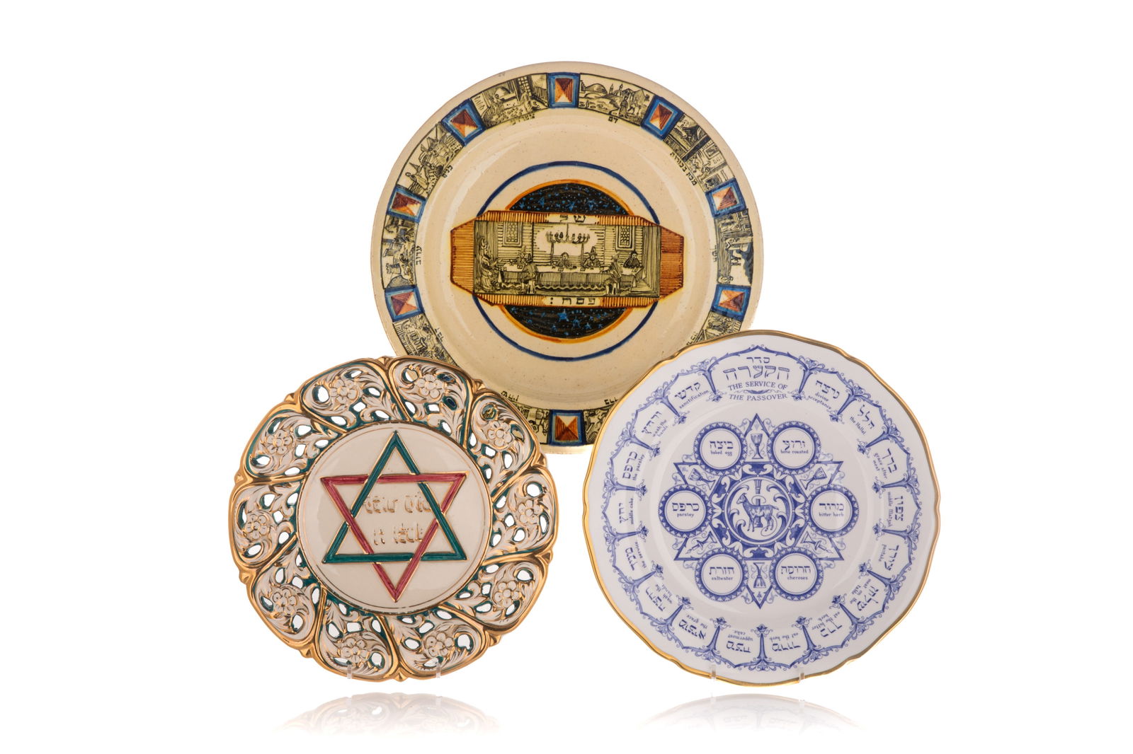 THREE JEWISH POTTERY PLATES: Pottery Seder plate with impressed maker, possibly Hungarian, Italian Capodimonte pierced plate and Spode porcelain Seder plate. Dia 32.5cm (12 1/4in)