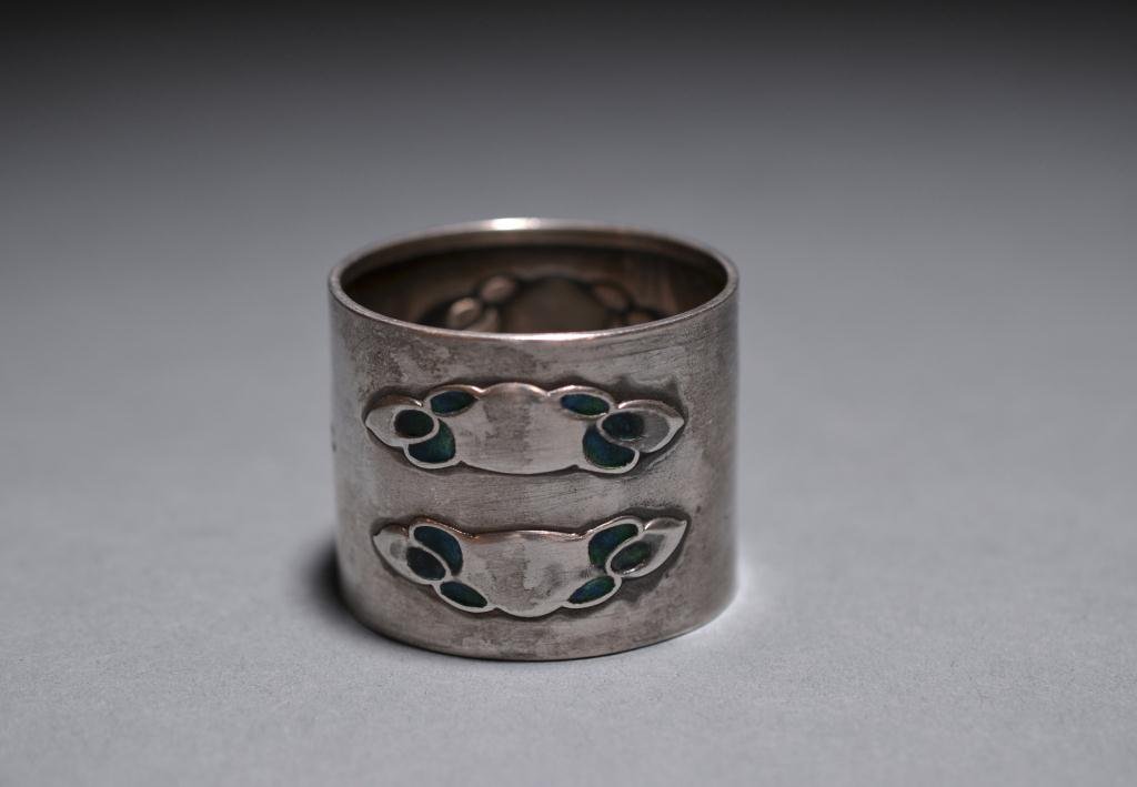 LIBERTY SILVER & ENAMEL ART NOUVEAU NAPKIN RING: An English sterling silver napkin ring in the Art Nouveau style with enamelled decoration. Birmingham 1903 maker Liberty & Co. 38 gm.