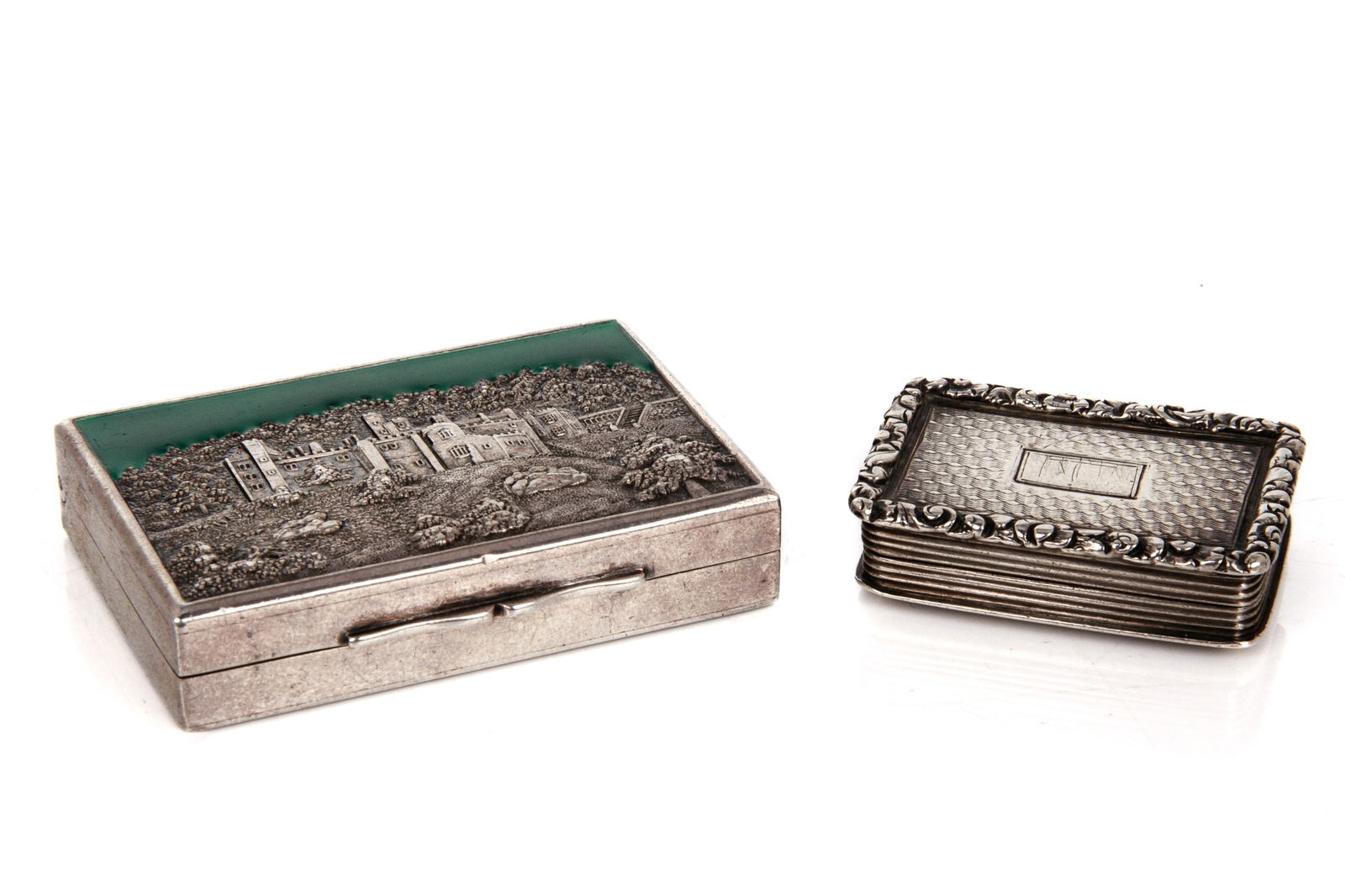 NATHANIEL MILLS VINAIGRETTE, 72g: An early 19th century sterling silver vinaigrette by the well-known maker Nathaniel Mills, Birmingham, 1829. Together with an enameled castle top pill box, London, 1907, maker Cohen & Charles. L. of p