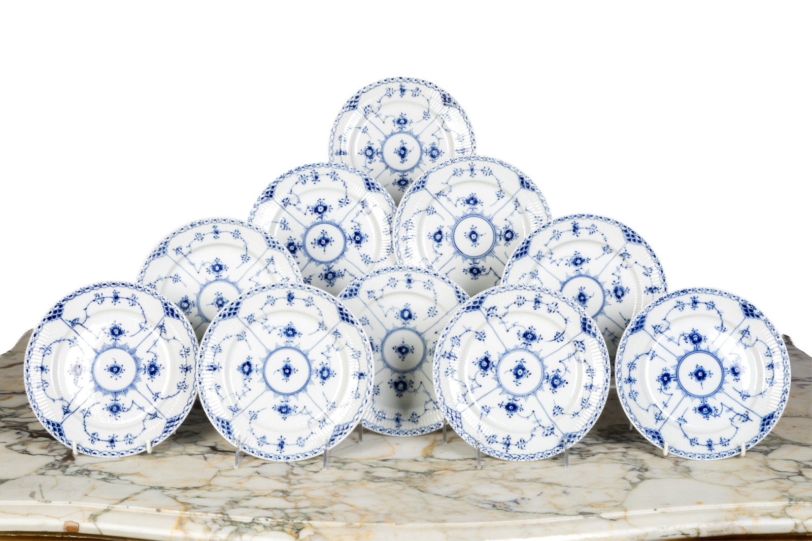 TWENTY ROYAL COPENHAGEN BLUE FLUTED SALAD PLATES: Twenty blue fluted salad plates in the half lace pattern, style #573 Dia.: 7 1/2 in. (19 cm)