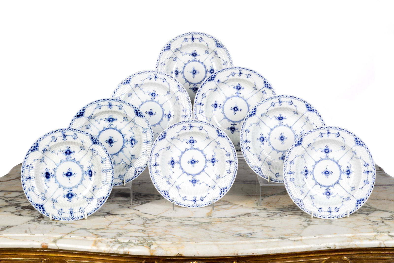 EIGHT ROYAL COPENHAGEN BLUE FLUTED RIM SOUP BOWLS: Eight blue fluted rim soup bowls in the half lace pattern, style #566. Dia.: 21.3 cm (8 3/8 in.)