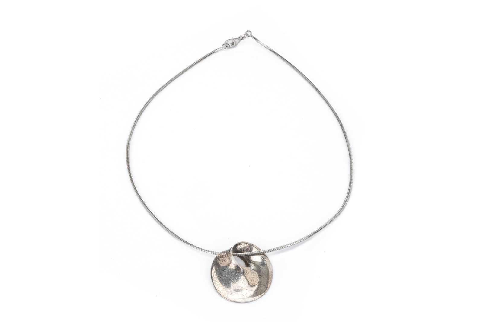 GEORG JENSEN SILVER PENDANT ON CHAIN, 13.4g: Inverted swirl design pendant, model number 374, on silver chain. L. of chain: 38cm L. of pendant: 2.9cm