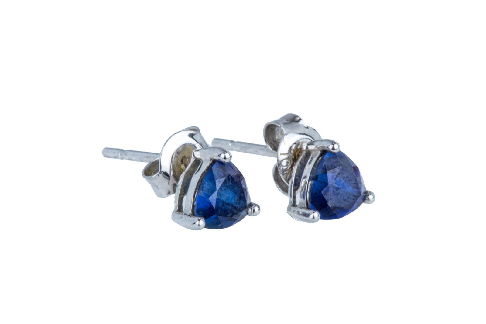 PAIR OF 10K GOLD AND BLUE TOPAZ STUD EARRINGS 0.9g: A pair of 10k white gold stud earrings, each set with a small trilliant cut blue topaz, testing as blue topaz, marked 10k.L. 6mm