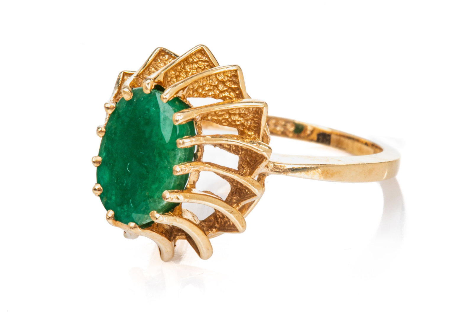 14K YELLOW GOLD AND EMERALD RING, 3.4g: A 14k yellow gold dress ring set with an oval emerald, emerald is heavily included, marked 14k, size 5 1/2.