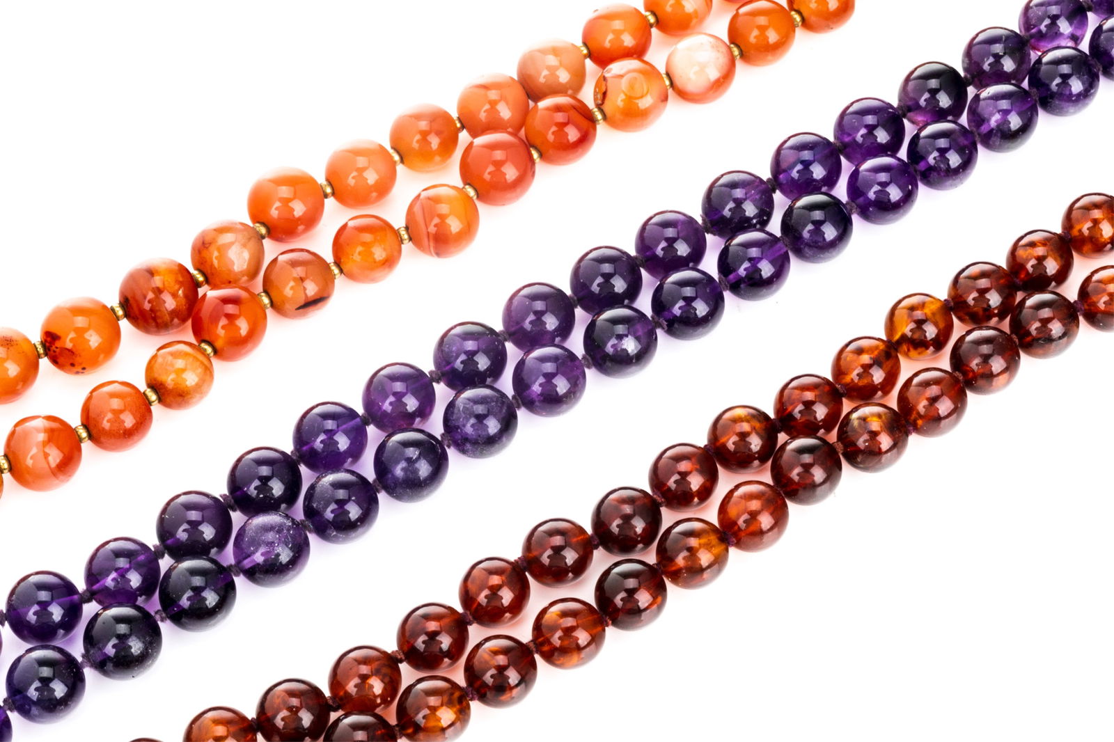 THREE LONG BEADED POLISHED STONE NECKLACES (1 of 2)