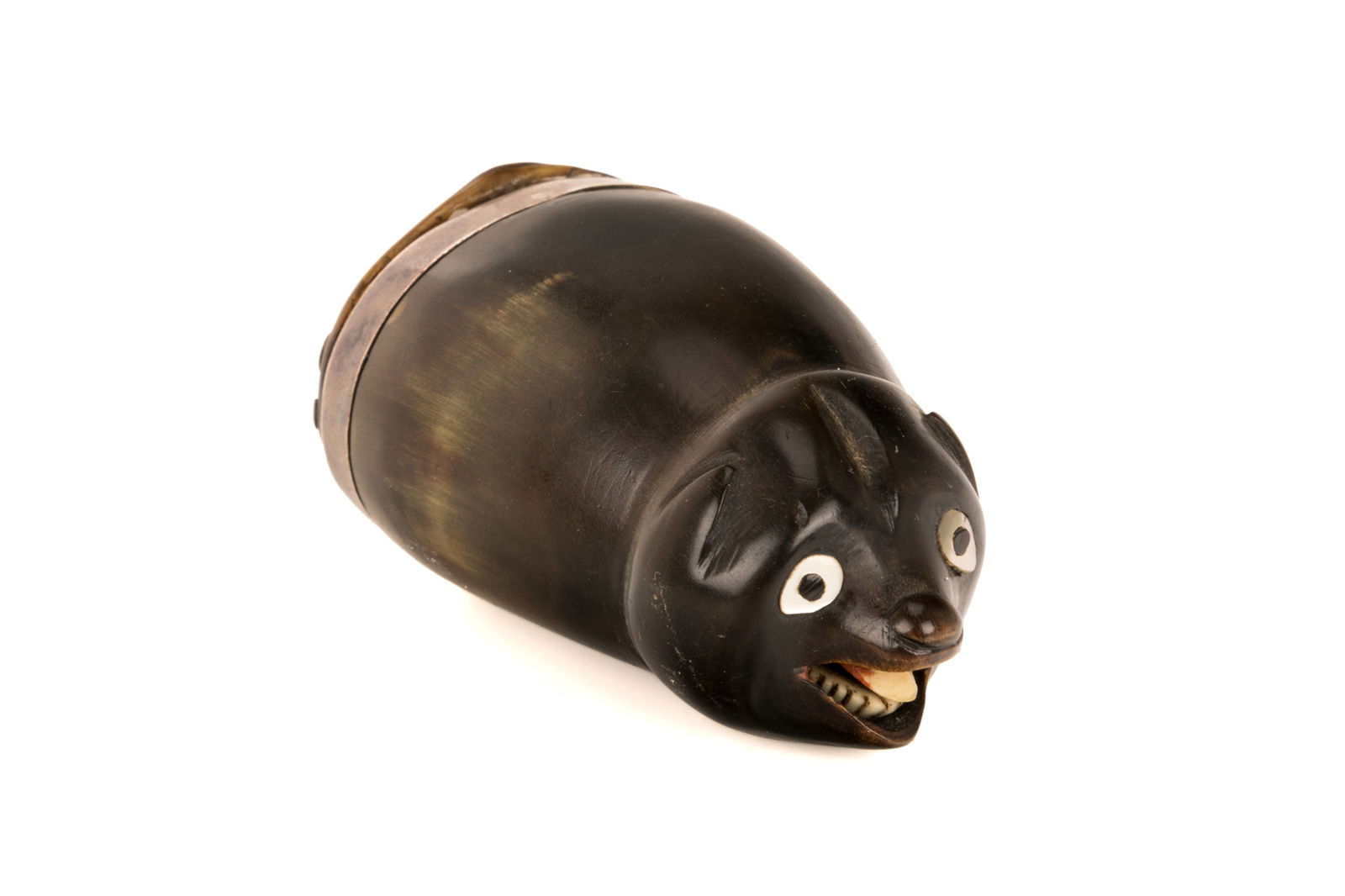 CARVED SCOTTISH SNUFF MULL: Scottish carved snuff mull in the shape of a bear with its mouth open and tongue lolling out. Wide, abalone inset eyes. Hinged silver lid with thistle motif and nameplate for 'J. Laurie' on the lid. N