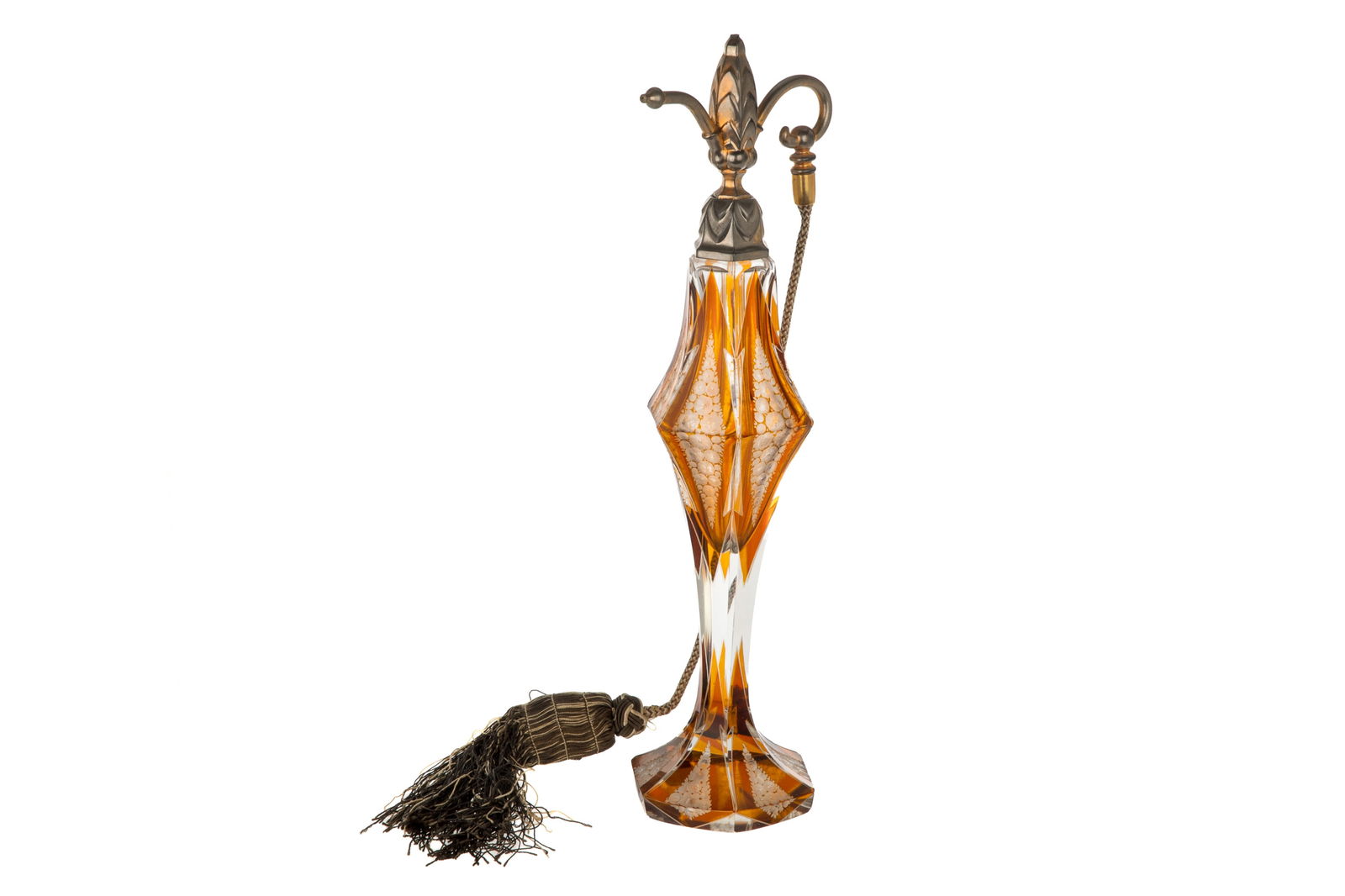 LARGE MOSER ART DECO ATOMIZER BOTTLE: Large Moser cut glass bottle with tangerine-coloured glass inserts and etched floral motifs. Attached to a tasseled atomizer with an exaggerated finial nozzle. Signed 'Moser Karlsbad' to the underside