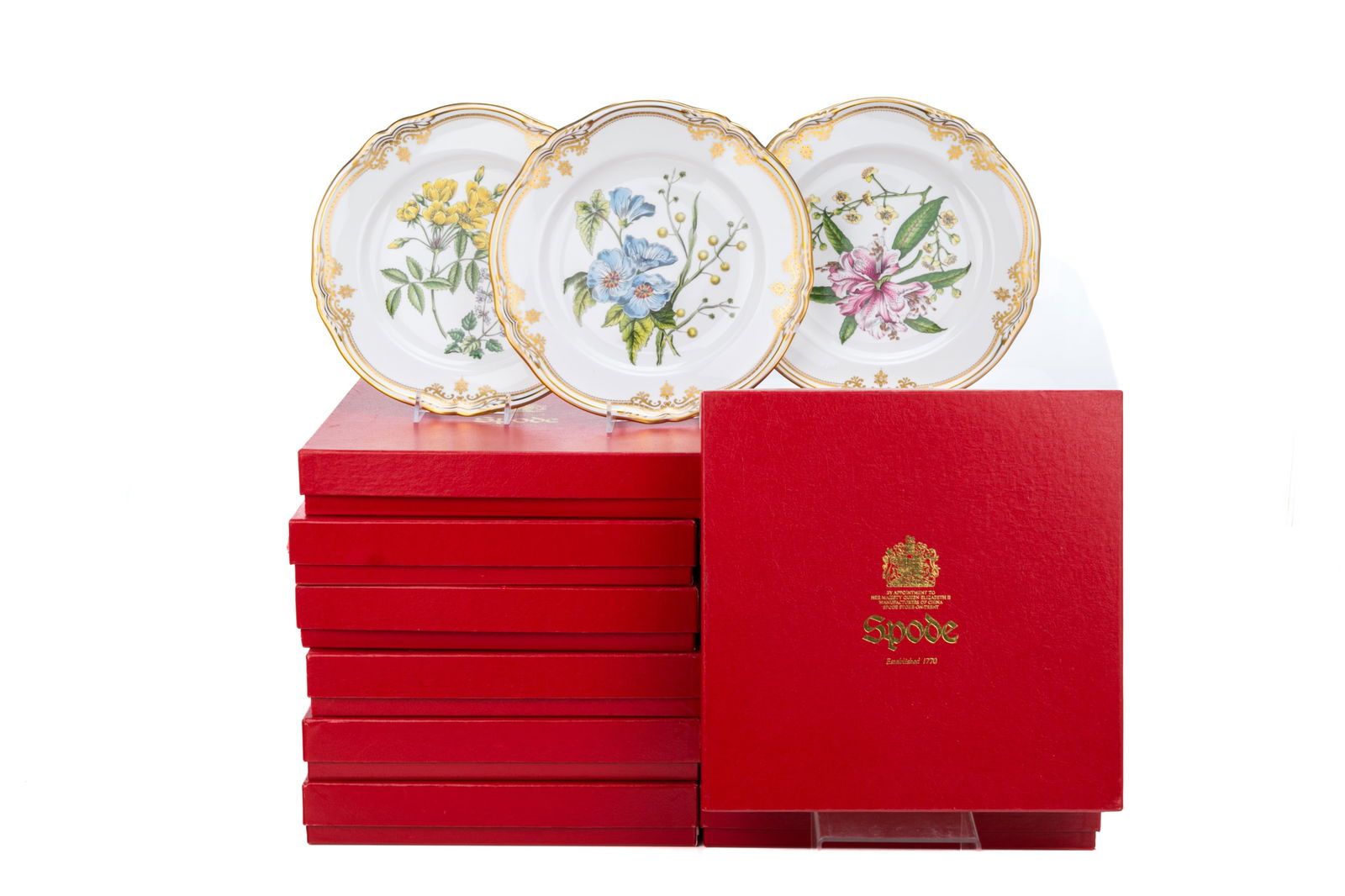 TWELVE SPODE 'STAFFORD FLOWERS' PLATES: Group of twelve Spode plates in the 'Stafford Flowers' pattern with floral bouquets and gilt rims to each. All in their original red Spode boxes and some with dust sleeves. English, 20th C. Dia.: 23 c