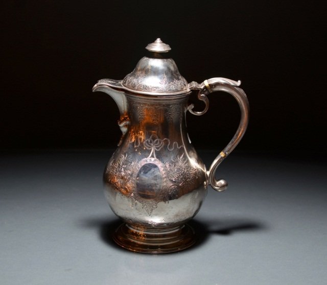GEORGIAN SILVER HOT WATER POT: - bulbous body with bright cut floral sprays and swags, crested. Maker's mark Fuller White, London, 1757. H 25 cm. (9 3/4 in.) 841 grams.